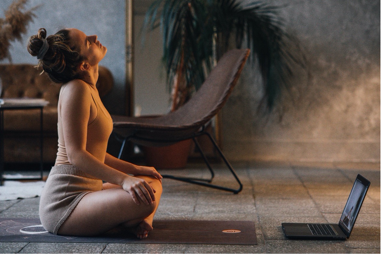 Yoga teacher setting up subscriber content